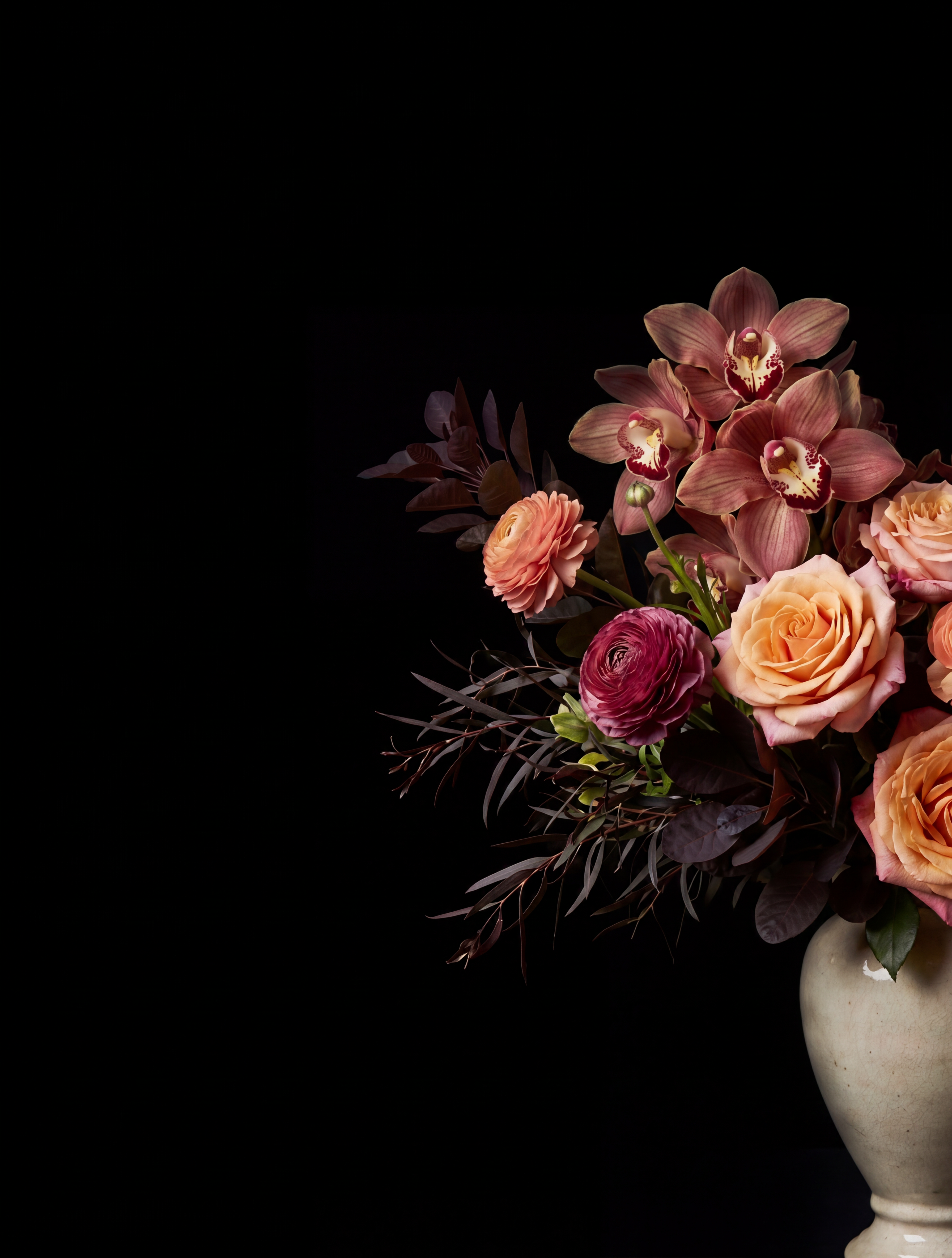 A bespoke Flora bouquet photographed against deep shadow.